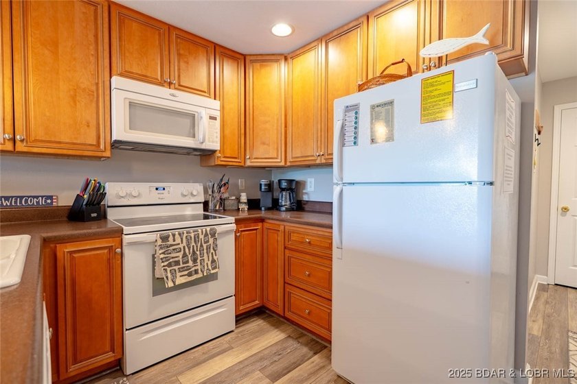 Welcome to this beautifully remodeled, walk-in end unit at The - photo 13