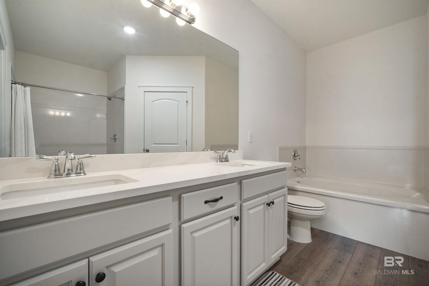 Nestled on nearly three acres of pristine land in Fairhope, this - photo 23
