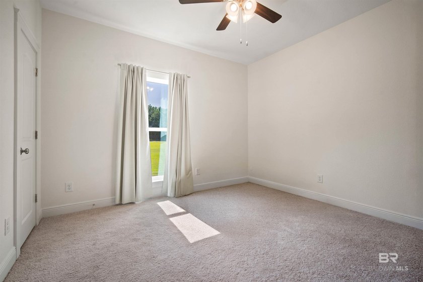 Nestled on nearly three acres of pristine land in Fairhope, this - photo 25