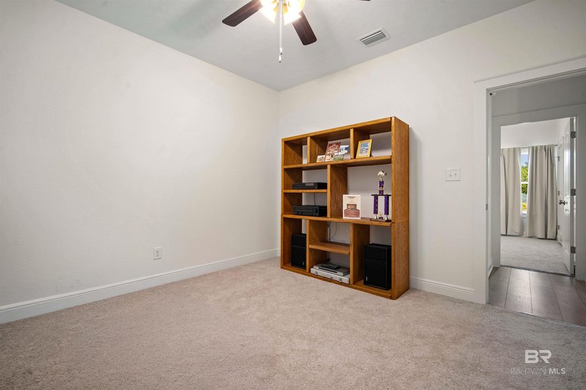Nestled on nearly three acres of pristine land in Fairhope, this - photo 26