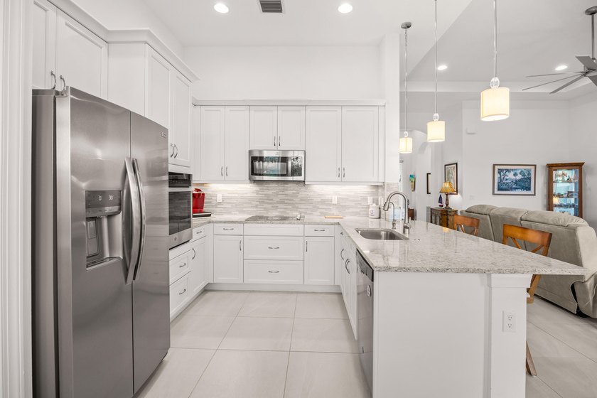 Welcome to 23018 SW Accesi Way, in PGA Verano. This large - photo 13