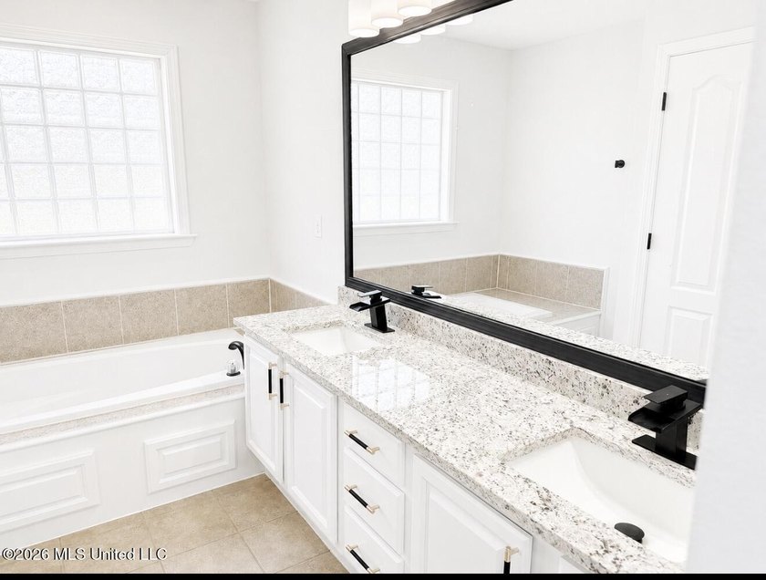 This beautifully updated 4-bedroom, 2-bath home is located in a - photo 12
