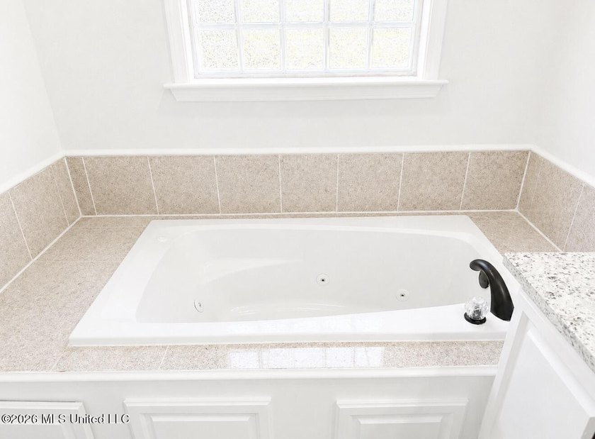 This beautifully updated 4-bedroom, 2-bath home is located in a - photo 15