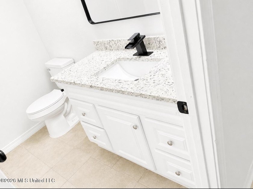 This beautifully updated 4-bedroom, 2-bath home is located in a - photo 19