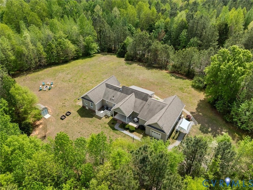 Custom-built and situated on 3.42 private wooded acres, this - photo 49