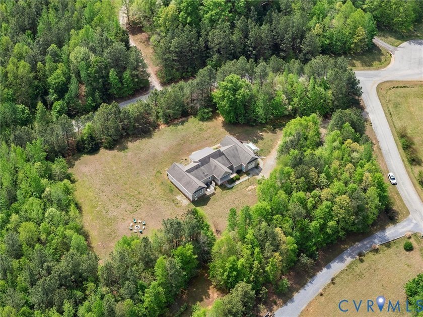 Custom-built and situated on 3.42 private wooded acres, this - photo 50