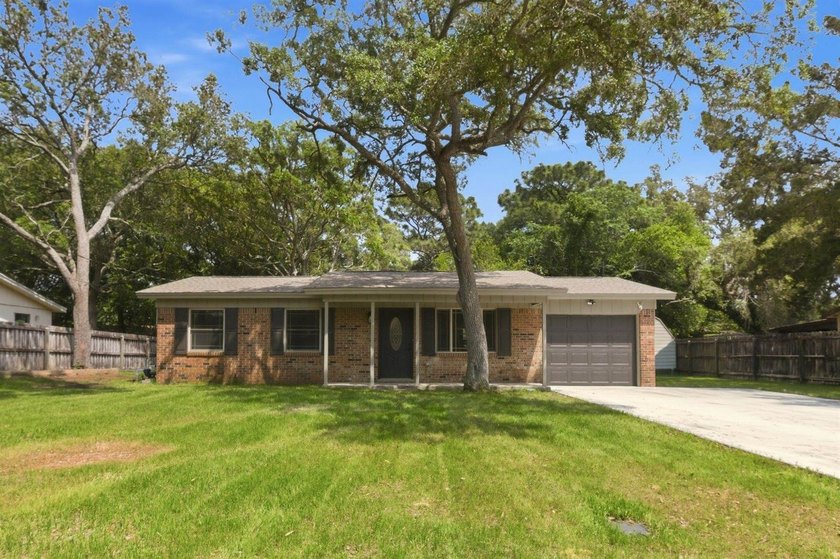 Welcome to your new home! This beautifully remodeled brick home - photo 2