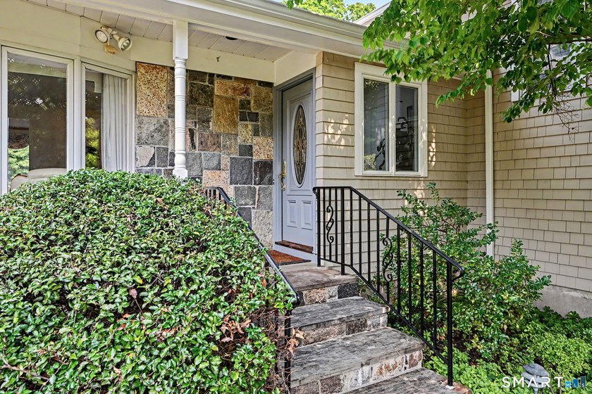 Tucked away on a quiet, tree-lined street in North Stamford - photo 2