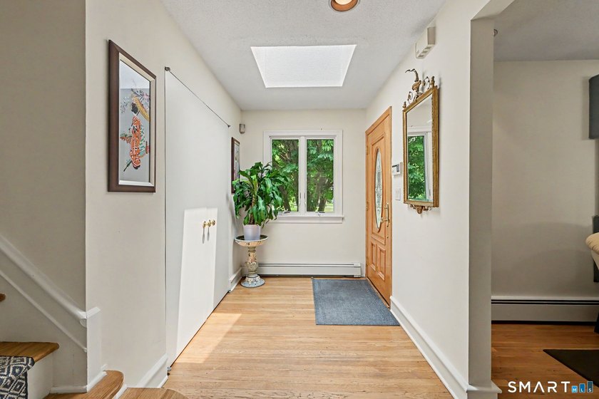 Tucked away on a quiet, tree-lined street in North Stamford - photo 3