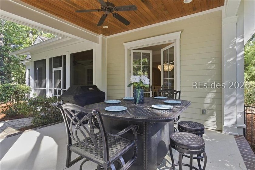 Hampton Lake is a gated community in Bluffton, centered around a - photo 22