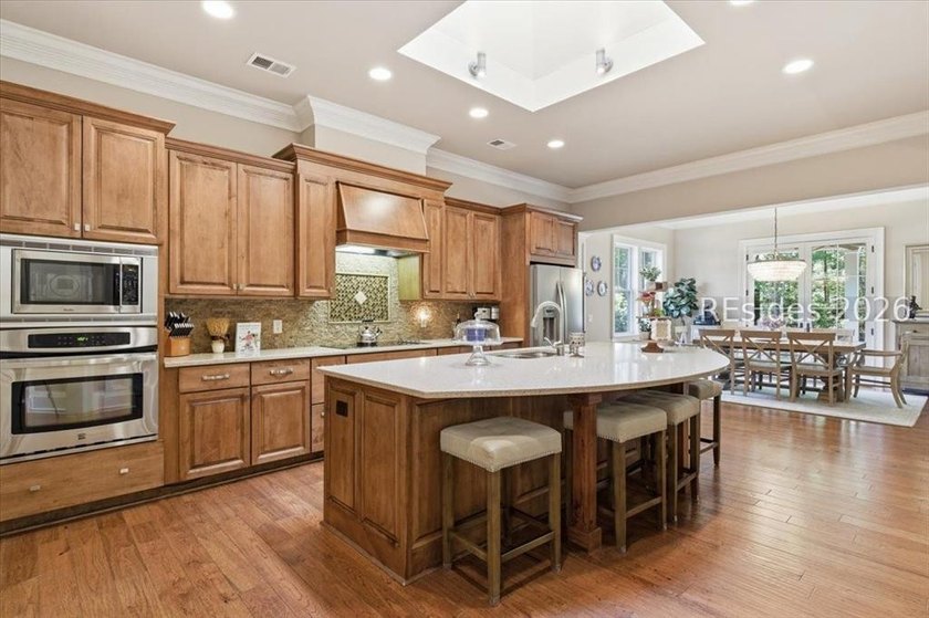 Hampton Lake is a gated community in Bluffton, centered around a - photo 28