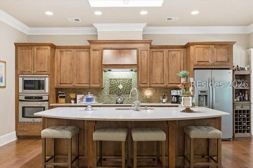 Hampton Lake is a gated community in Bluffton, centered around a - photo 29