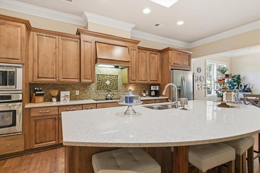 Hampton Lake is a gated community in Bluffton, centered around a - photo 30