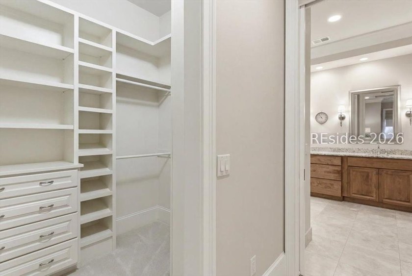 Hampton Lake is a gated community in Bluffton, centered around a - photo 41