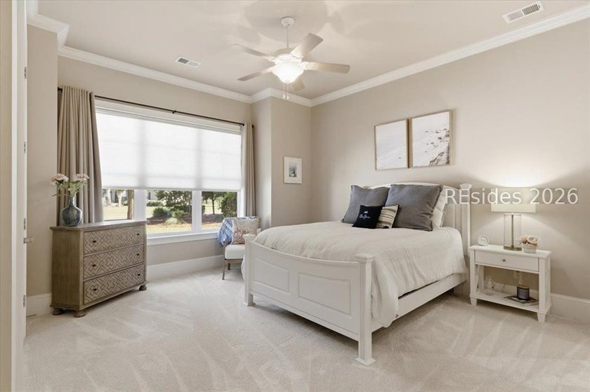 Hampton Lake is a gated community in Bluffton, centered around a - photo 46