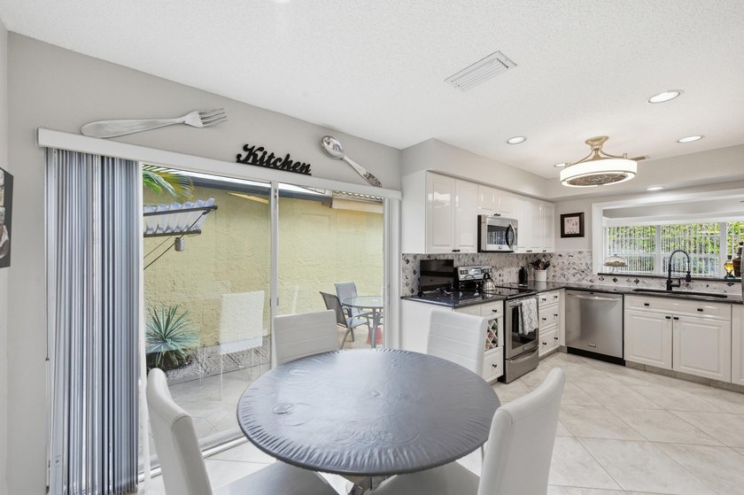 Nestled in the sought-after Villas of Green Glen within the - photo 15