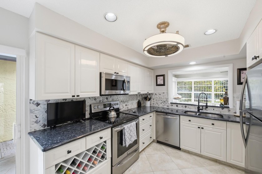 Nestled in the sought-after Villas of Green Glen within the - photo 17