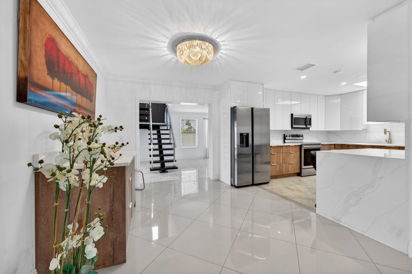 Stunning &amp; fully expanded two-story pool home in the heart of - photo 13