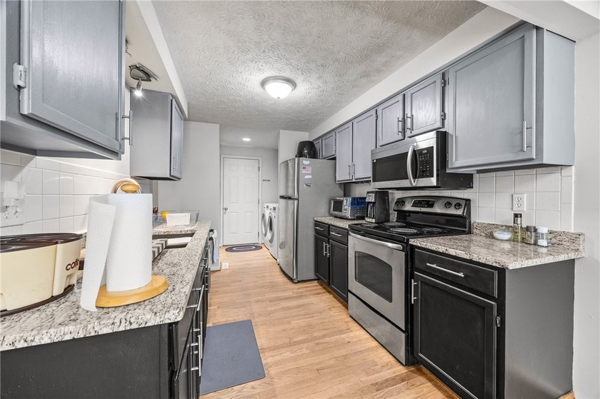Welcome to this beautifully maintained townhome, which offers - photo 12