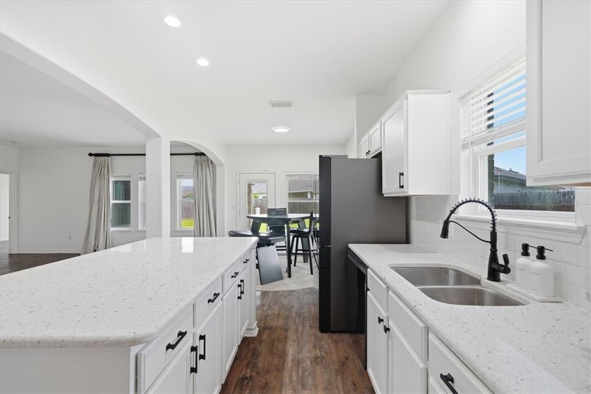 NEWLY renovated four-bedroom,two-bathroom split-plan home with - photo 11