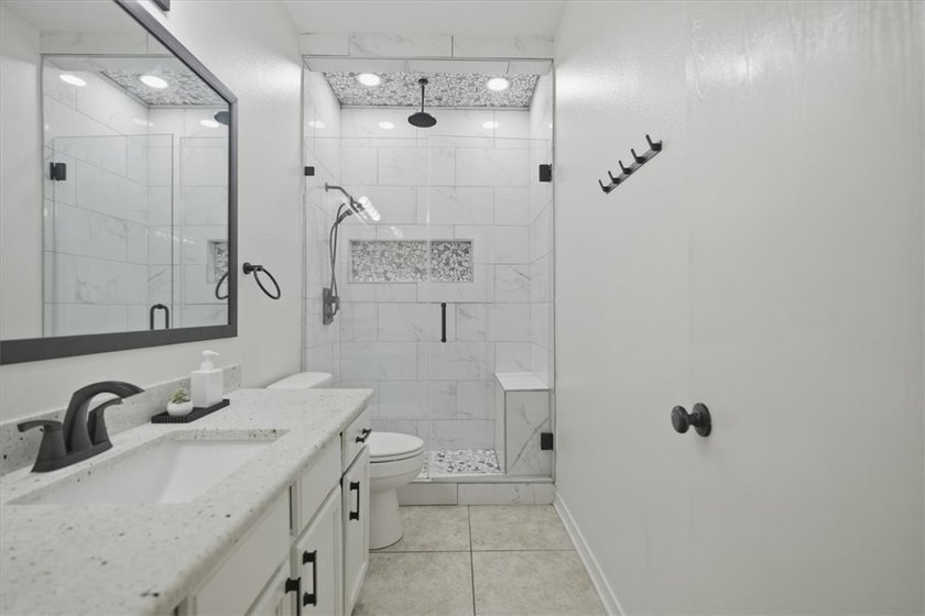 NEWLY renovated four-bedroom,two-bathroom split-plan home with - photo 16