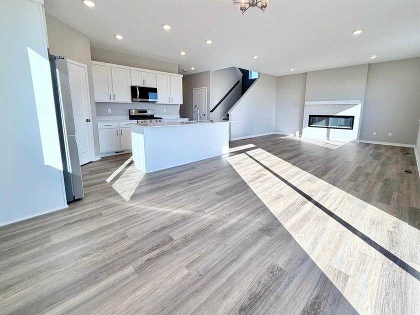 Highlights include a spacious 4 BAY GARAGE, Two Story modern - photo 3