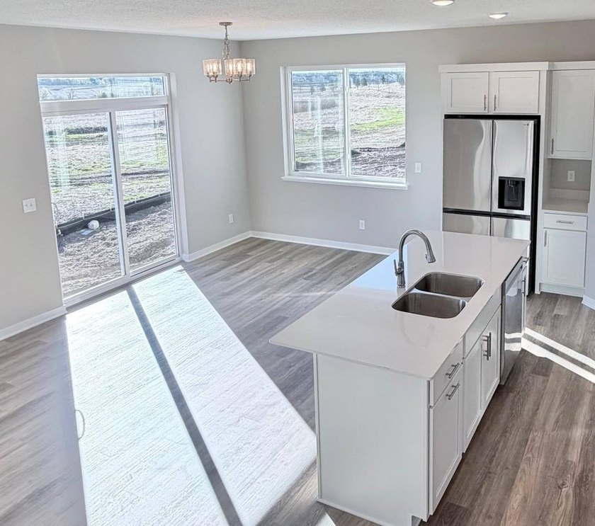 Highlights include a spacious 4 BAY GARAGE, Two Story modern - photo 5