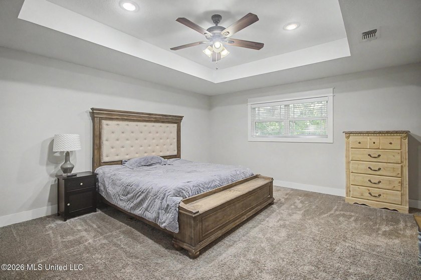 Tucked away on a quiet, tree-lined street, this beautifully - photo 18