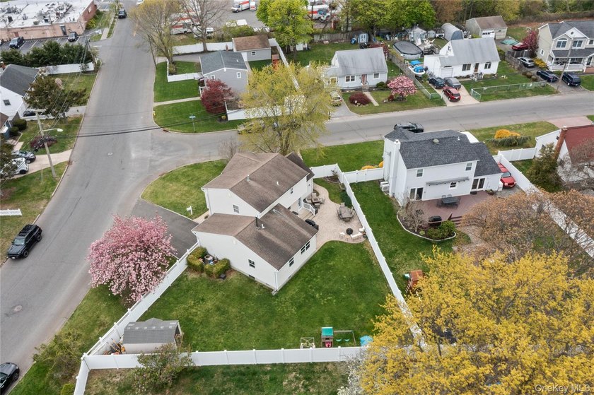 This beautifully renovated Colonial in East Islip sits on an - photo 2