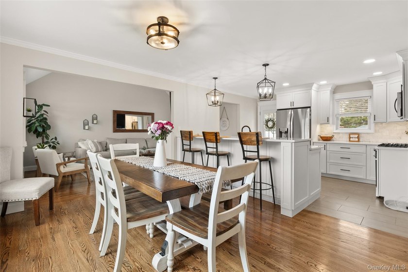 This beautifully renovated Colonial in East Islip sits on an - photo 3
