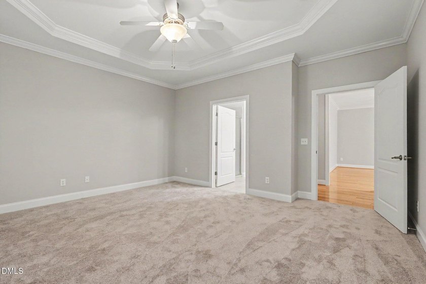 Beautiful brick ranch with custom moldings, tray ceilings, and a - photo 14