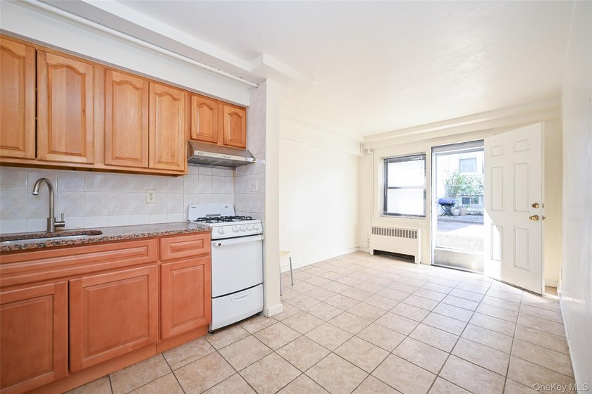 Semi-detached brick 2-family in prime Flushing, across from - photo 3