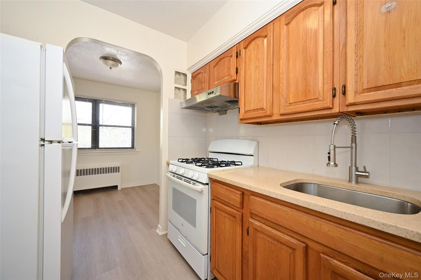 Semi-detached brick 2-family in prime Flushing, across from - photo 5