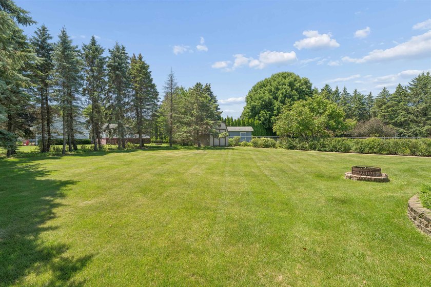 Nestled on over 1/2 acre, this well-maintained home is tucked - photo 35