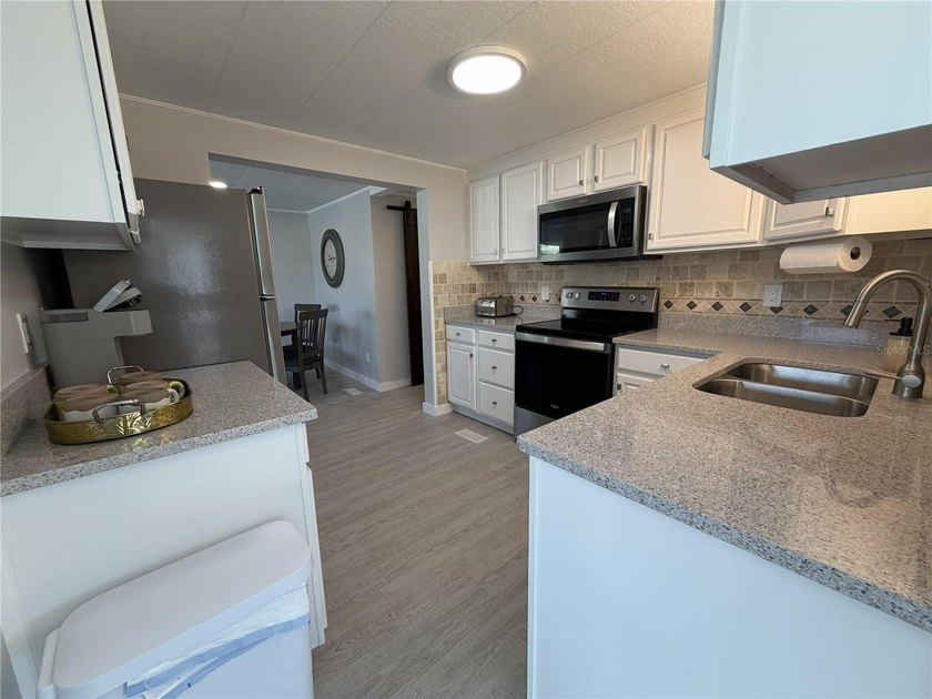 This residence showcases high-quality craftsmanship and includes - photo 11