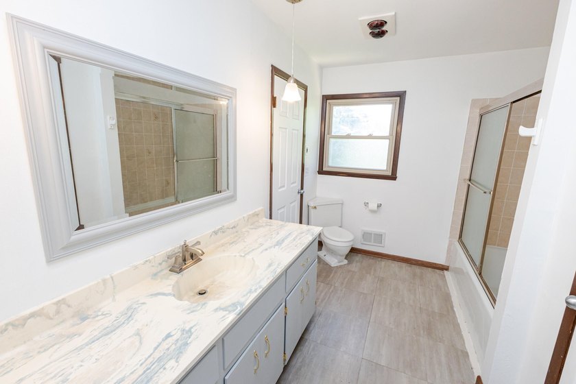 Enjoy the perfect blend of space, updates, and location on this - photo 24