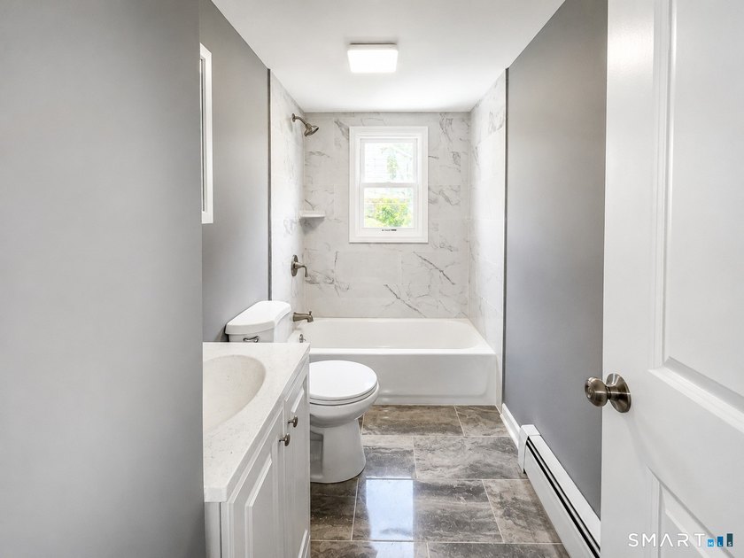 Move right into this beautifully renovated Cape-style home - photo 4