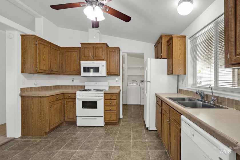 Welcome home to this inviting 3-bedroom, 2-bath manufactured - photo 4
