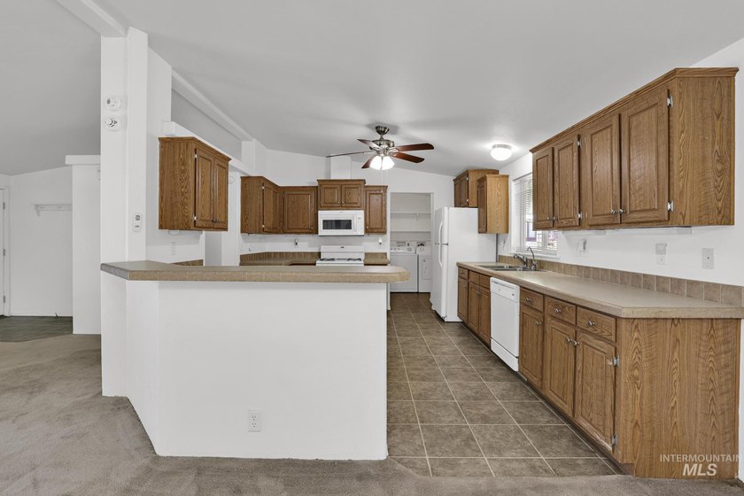 Welcome home to this inviting 3-bedroom, 2-bath manufactured - photo 7