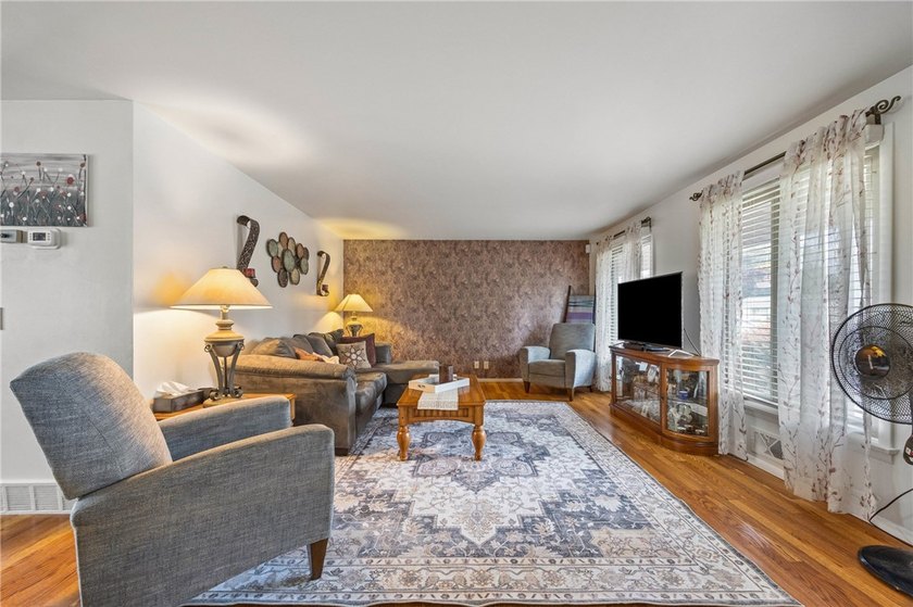 Welcome to your dream home nestled in the Town of Greece! This - photo 6