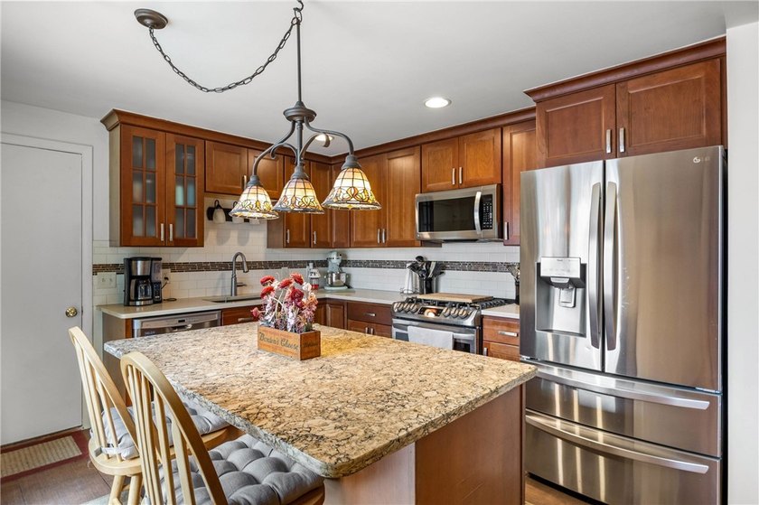 Welcome to your dream home nestled in the Town of Greece! This - photo 10