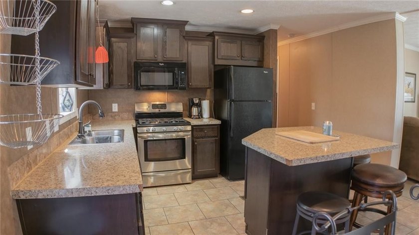 This charming 1,350 sq ft manufactured home sits on a permanent - photo 11