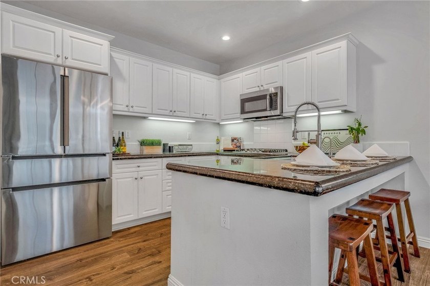 Inviting townhome in the gated Village on Oak community. Walk to - photo 11