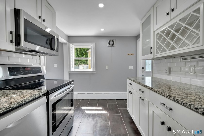 Beautifully updated and deceptively spacious, this move-in ready - photo 7