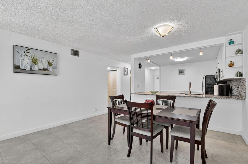 Fully updated 2/2 with 1-car garage! Features an open kitchen - photo 11