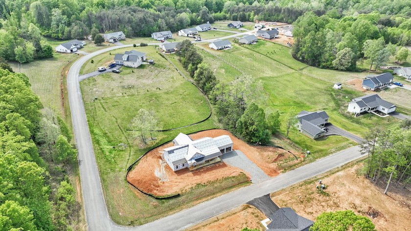 Quality new construction on a beautiful 1.7-acre corner lot! - photo 25