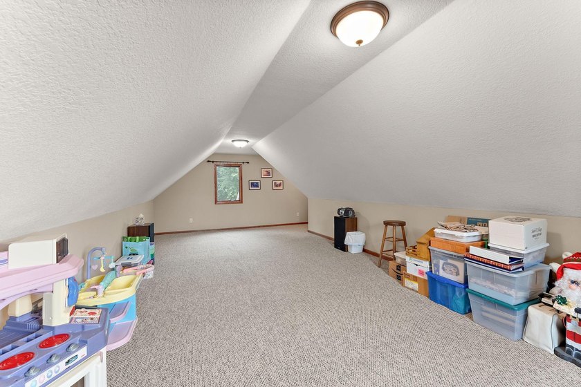 This inviting and spacious two-story home sits on an incredible - photo 26