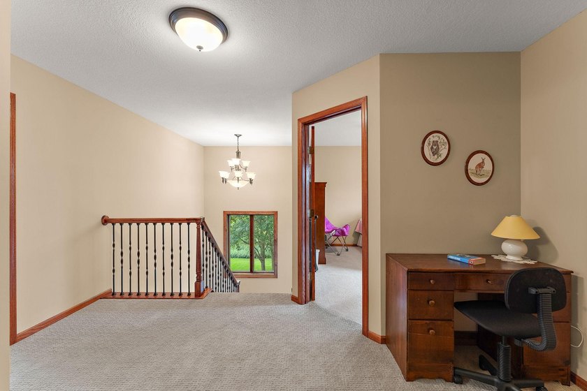 This inviting and spacious two-story home sits on an incredible - photo 27
