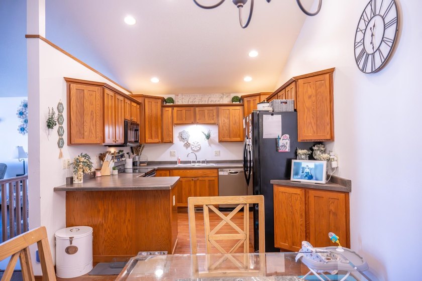 Each unit features a spacious, open~concept layout where the - photo 39