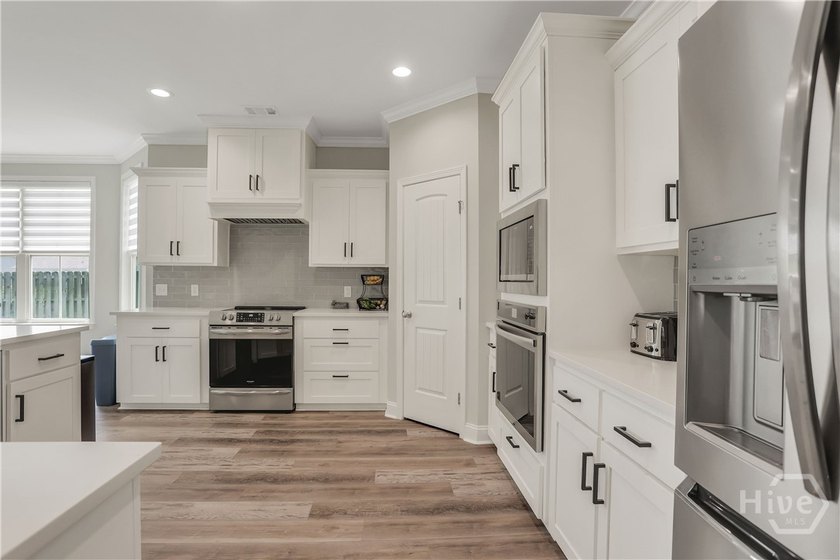 Located in the welcoming Woodland Trail Community with - photo 14